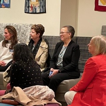 Dr. Beverly Daniel Tatum sitting on the couch before being called to the front of the room.