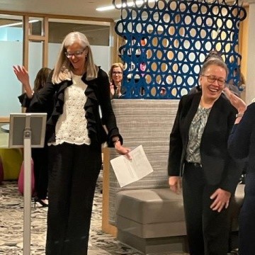 Dr. Beverly Daniel Tatum (right) getting congratulated at the naming event.