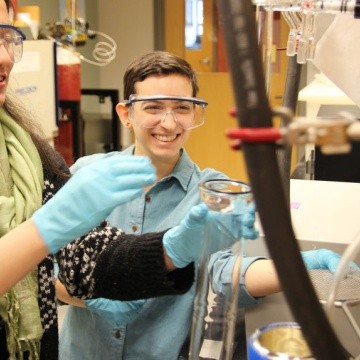 Students using a vacuum apparatus in the chemistry laboratory