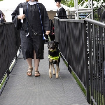 Mount Holyoke Commencement 2024 - Student leaves the stage with her service animal