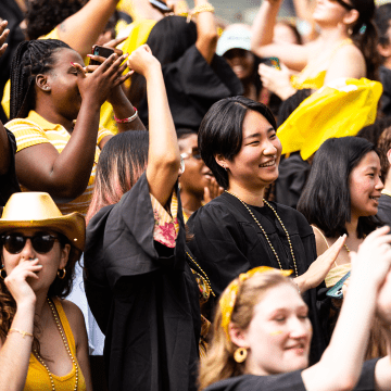 A group of seniors clapping and cheering during Convocation 2022