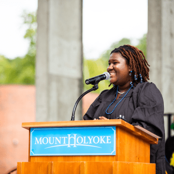 Maille Romulus ’24, Student Government Association president, addresses students at Convocation 2022
