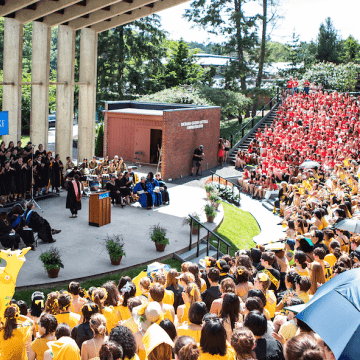 Singers performing on the ampitheater stage during Convocation
