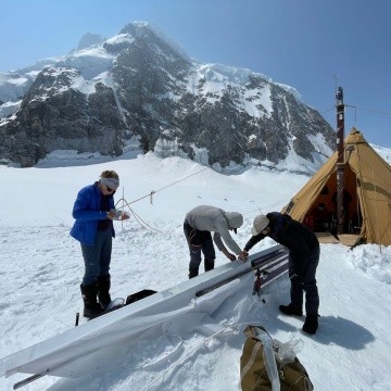 Bridget Hall ’24 and team processing a core from the glacier.
