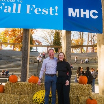 Student with a family member at Mount Holyoke's Fall Fest in 2024