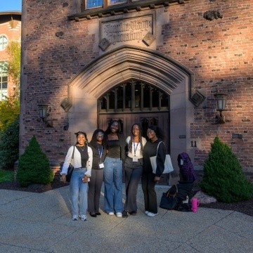 Leap Symposium 2025 - A group of students stand outside.