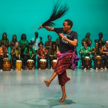 Dance on stage during the AGOO! concert — a night of West African music and dance.