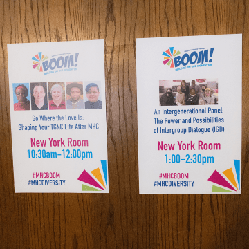 Signs on a doorway introducing the sessions that took place during the 2023 BOOM! Learning Symposium