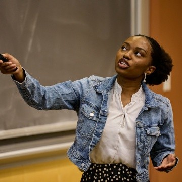Mount Holyoke College | Senior Symposium 2024 - A 2024 graduate giving a presentation of their research