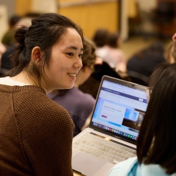 Mount Holyoke College | Senior Symposium 2024 - Audience members discussing the research presented