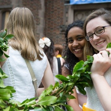 Students smiling as they carry the Laurel Chain