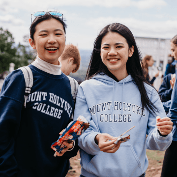 Students enjoying ice cream treats at the summit of Mount Holyoke on Mountain Day 2022