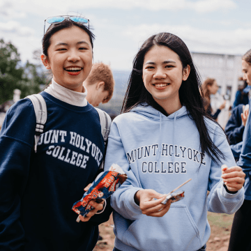 Students enjoying ice cream treats at the summit of Mount Holyoke on Mountain Day 2022