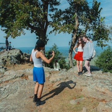 Mountain Day 2024 - Students pose at the top of the mountain for a photo.