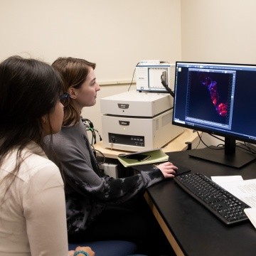 Neuroscience students working with equipment in a lab