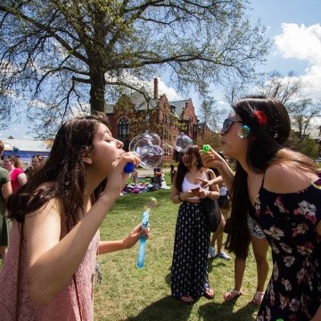 Students blowing bubbles on Pangy Day