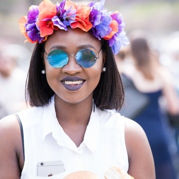 A student wearing a flower crown on Pangy Day