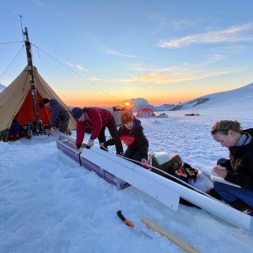 Bridget Hall ’24 and team processing a core from the glacier.