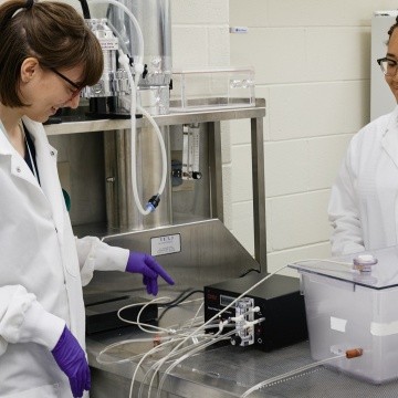 Psychology students using lab equipment