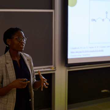 A student addresses the audience during Senior Symposium 2023