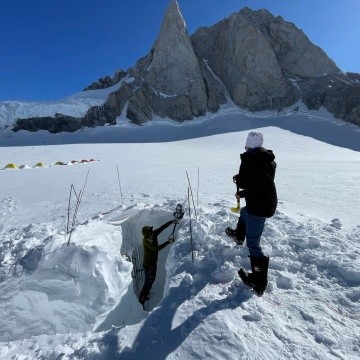 Bridget Hall ’24 shoveling out a snow pit on the glacier.