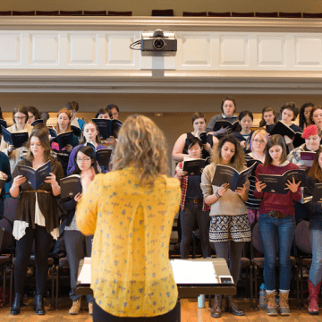 A vocal ensemble rehearsing