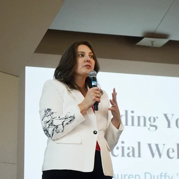 Keynote speaker Lauren Duffy ’03, CEO of UMass Five Credit Union, addresses conference attendees.