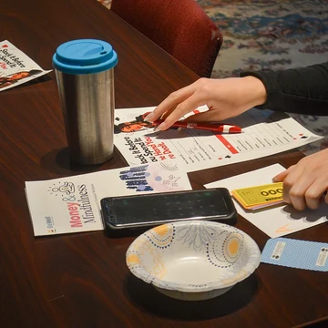 Students participate in an interactive exercise illustrating the benefits of budgeting.
