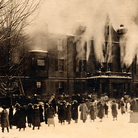 A photograph of the fire at the old Rockefeller Hall on December 21, 1922, while students look on.
