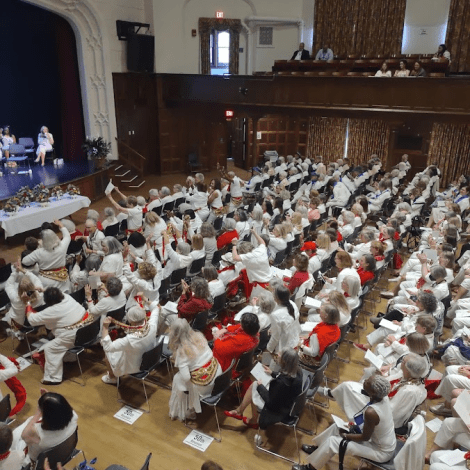 Alums seated in Chapin Auditorium for the annual meeting at Mount Holyoke College.