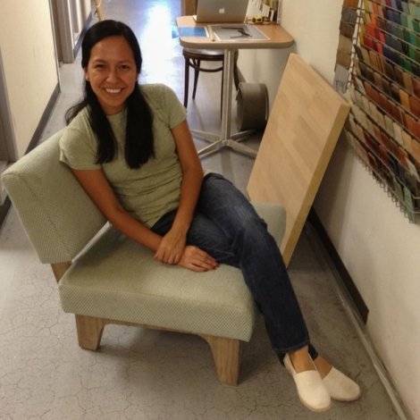 Aleida sitting in a mock-up of a custom chair designed by Thread Collaborative. After confirming all dimensions and judging the chair's overall comfort, the mock-up was approved and moved into production.