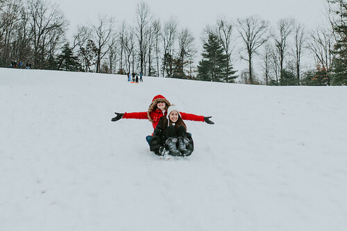 Students sledding on campus