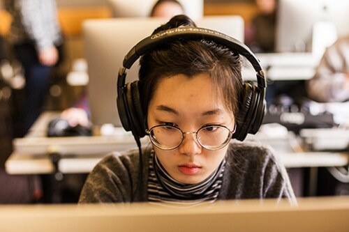 A student wearing headphones