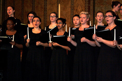 Vespers - students singing wearing all black and holding candles