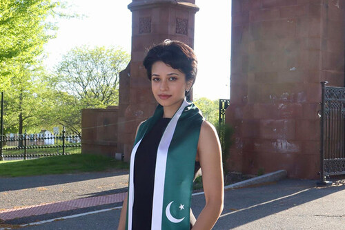 Fatima Shah stands by the Gates.