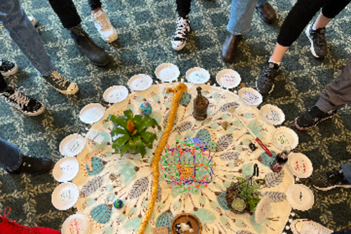 Lauren Gaia, Now A Restorative Justice centerpiece is shown with a collection of talking pieces.