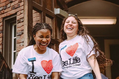 Student Leaders wearing "I Love Res Life" t-shirts and laughing together