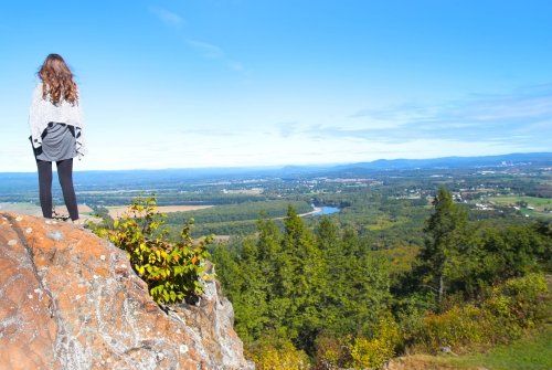 A student overlooking the Pioneer Valley on Mountain Day