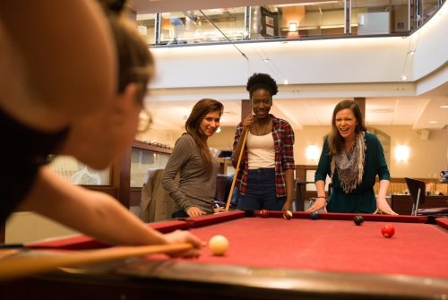 Students playing pool