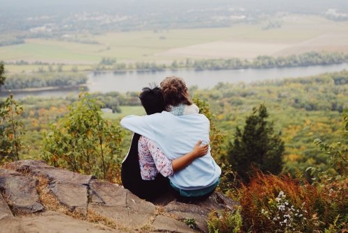 Students embracing atop Mount Holyoke on Mountain Day 2019