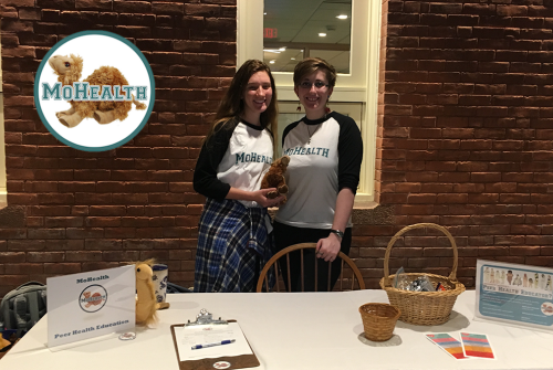 Two students working the MoHealth Educators table in Blanchard Hall