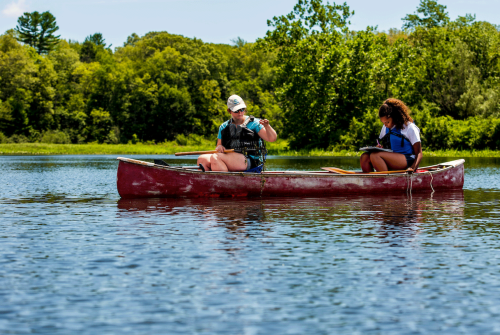 Students in a canoe taking samples