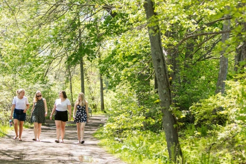 Students walking on a campus trail