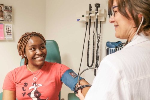 A student receiving a blood pressure check in Health Services