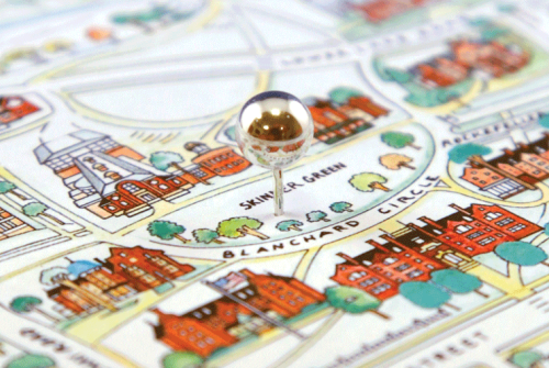 A close-up of a campus map with a push pin in the middle of Skinner Green