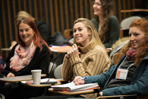 Students attentive and listening during an event.