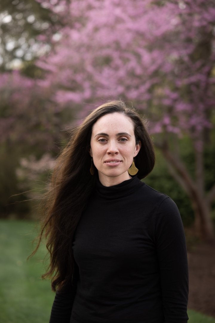 Caitlin-Lambert.jpeg Caitlin Lambert ’09 in front of a pink flowering bush on the Mount Holyoke College campus.