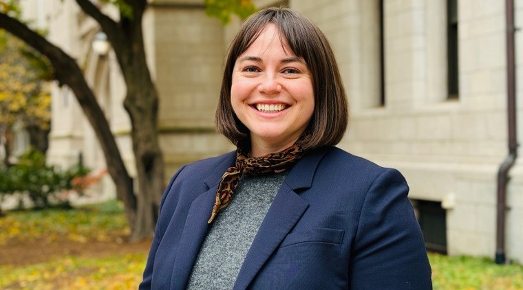 Anne Taylor (a woman wearing dark blue with short brown hair)