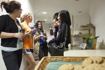 Students enjoying milk and cookies