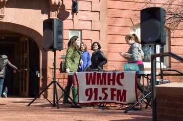 Students running a booth for WMHC outside the Blanchard Community Center